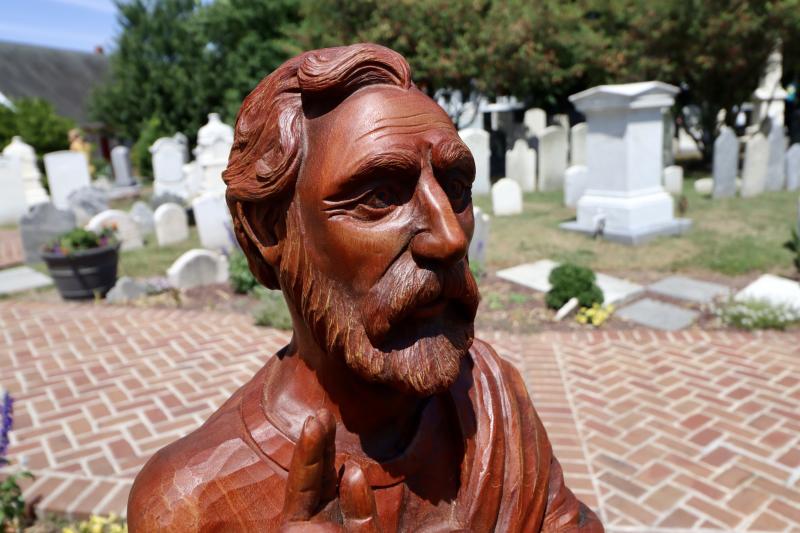 Woodcarver Ray Kinman created the statue from Honduran mahogany. It took him and his team more than two years from design to finish.